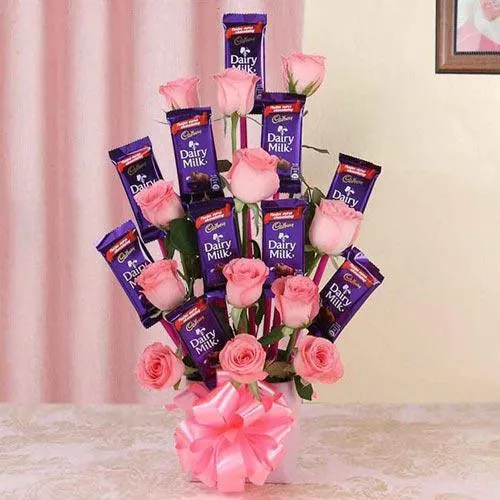 Marvelous Arrangement of Roses with Cadbury Dairy Milk Chocolates