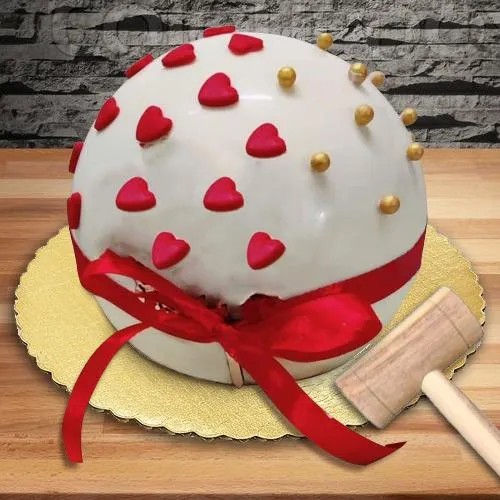 Delectable Round PiÃ±ata Cake with Hammer