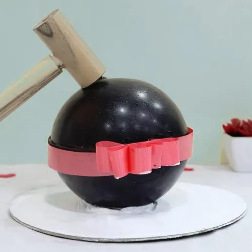 Mouth-Watering Chocolate Ball PiÃ±ata Cake with Hammer