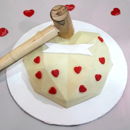 Luscious White Heart Shape PiÃ±ata Cake