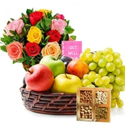 Delectable Assorted Fruits Basket with Dry Fruits N Flowers Arrangement