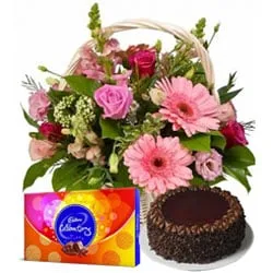 Online Chocolate Cake with Cadbury Celebrations and Seasonal Flowers Basket