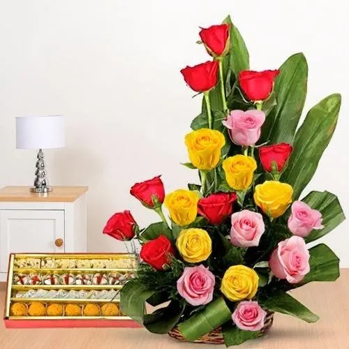 Admirable colorful mixed Roses and palatable assorted Sweets