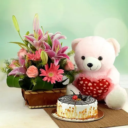 Amazing Gift of Butterscotch Cake n a Basket of 14 Pink Flowers