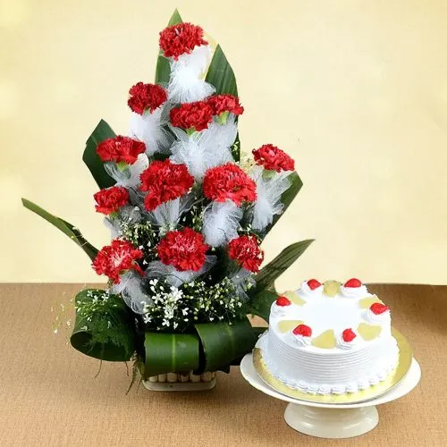 Breathtaking Combo of Red Carnations Bouquet with Pineapple Cake