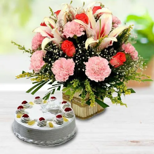 Enticing Mixed Flowers Basket with Pineapple Cake Combo