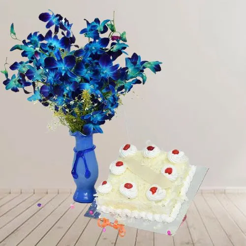 Fantastic Vase display of 12 Blue Orchids n White Forest Cake