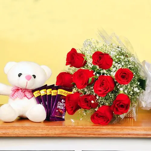 Enigmatic Combo of Cadbury Chocolates, Red Roses n Teddy for Valentine