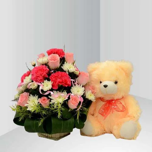 Lovely Mixed Blooms Basket with a Soft Cream Teddy