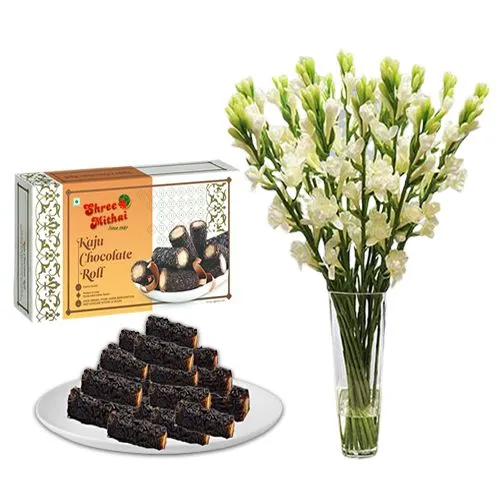 Gift of Kaju Choco Roll from Shree Mithai with Rajnigandha Stems in a Glass Vase