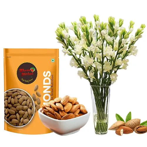 Pack of Almond Treat from Shree Mithai with Rajnigandha Stems in a Glass Vase