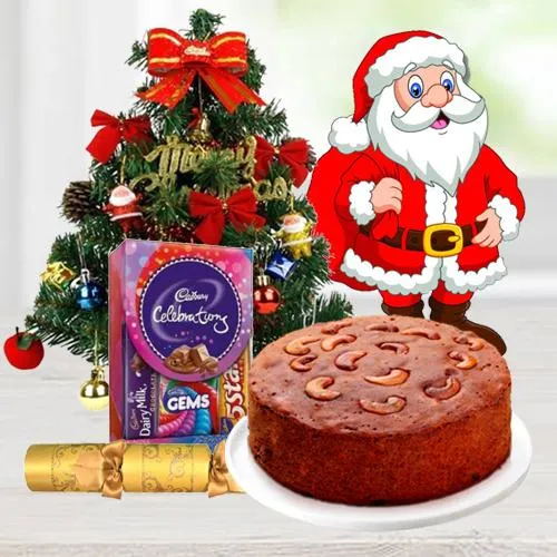 Christmas Fruit Cake 1 Lbs. with Christmas Tree 1 Ft. long artificial, Assorted Cadburyâ€�s Chocolates for hanging ( 130 G.), Star and Bells for decoration, Santa Claus and  Handheld Ribbon Crackers for Christmas