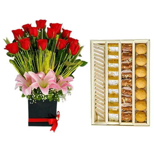 Adyar Ananda Bhawan Assorted Sweets with a Designer Flower Arrangement
