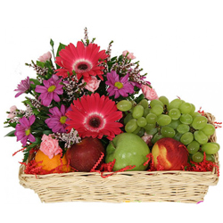 Alleviating fresh Fruit Basket added with stunning Flowers