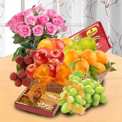 Mothers Day special basket of Fresh Fruits, Sweets and Pink Roses