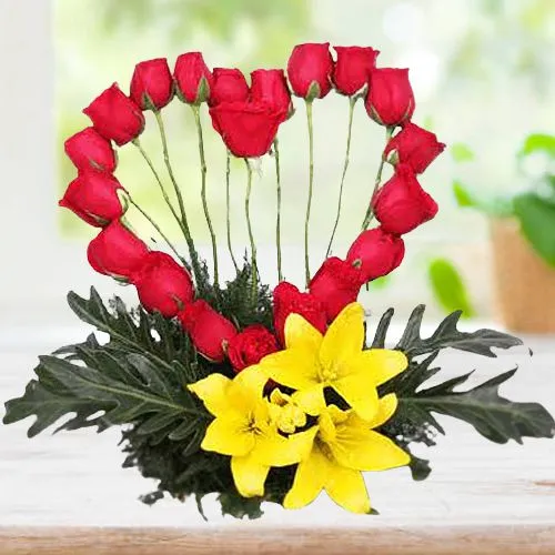 Superb Red Roses Heart with Lilies Arrangement