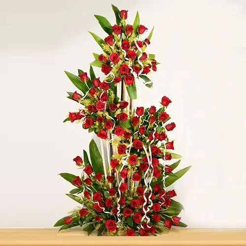 Lovely Red Roses Display in Tall Basket with Green Ferns