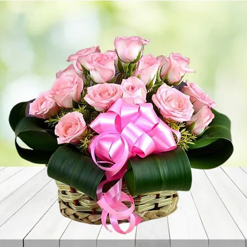 Tropical Display of Pink Roses with Greens in Basket