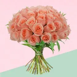 Blushing Bouquet of Peach Roses with Green Leaves