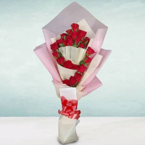 Stunning Tissue Wrapped Hand Bouquet of Red Roses
