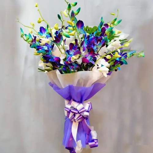 Elegant Bouquet of Blue n White Orchids with Tissue Wrapping	