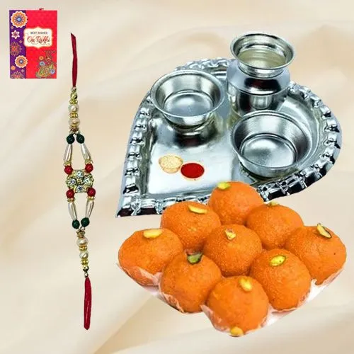 Laddoo from Haldiram and Silver Plated Paan Shaped Puja Aarti Thali along with Rakhi