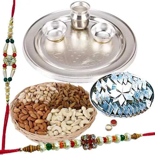 An amazing Silver plated Thali, <font color=#FF0000>Haldiram</font> Kaju Katli, Dry Fruits with free Rakhi, Roli Tilak and Chawal