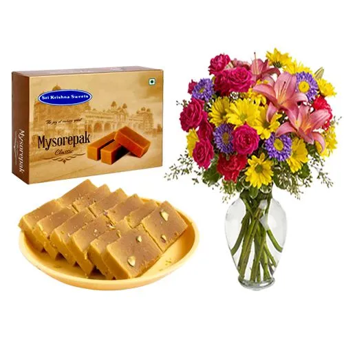 Sri Krishna Sweets Mysurpa with a Mixed Flower Arrangement