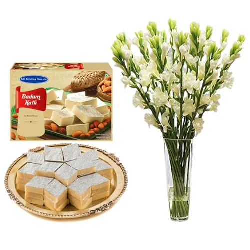 Sri Krishna Sweets Badam Kathli with a Rajnigandha Stems in a Glass Vase