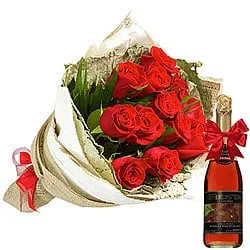 Superb Arrangement of Red Roses and Fruit Juice