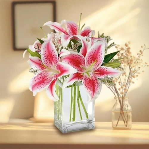 Pretty assemble of Pink Lilies in Glass Vase