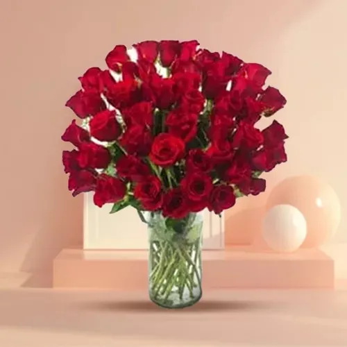 Artful Display of Two Doz Red Roses in a Glass Vase