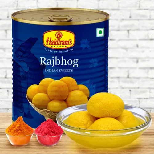 Nicely Gift Wrapped Raj Bhog 1 Kg from Haldiram with free Gulal/Abir Pouch. 
