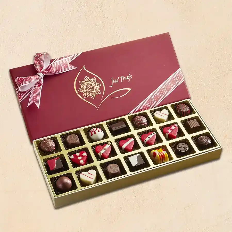 Elegant Love Truffle Collection featuring assorted truffles and heart-shaped marzipan truffles in a luxurious box