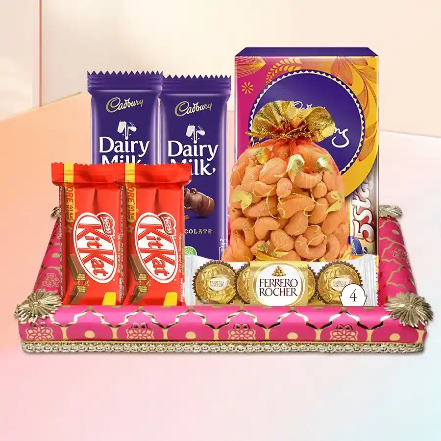 Lovely Gift of Cashew Potli with Chocolate Assortments featuring Ferrero Rocher, Cadbury Celebrations, Nestle Kit Kats, Cadbury Dairy Milk bars, and a decorative tray.