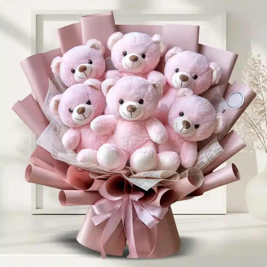 A bouquet of six pink teddy bears arranged cheerfully, exuding charm and warmth, perfect for gifting on special occasions.