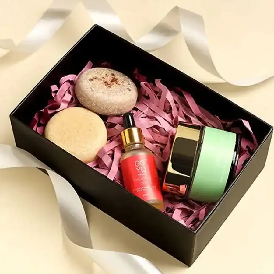 Radiant Self-Care Essentials Collection featuring sandalwood and coconut goat milk soaps, rosehip oil, and green bean face scrub.