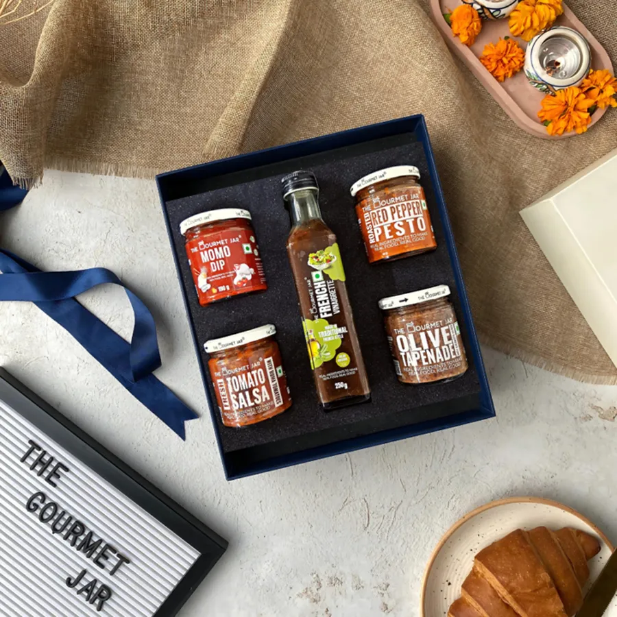 Savory Spread Sampler featuring a variety of gourmet dips and spreads, perfect for enhancing any culinary experience.