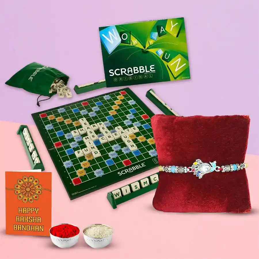 Fantastic Scrabble set for Raksha Bandhan with two rakhis, Roli Tilak, and Chawal