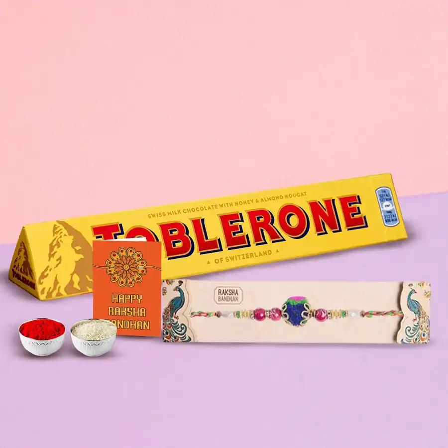 100g Toblerone chocolate bar with a Rakhi set including Roli, Tika, and Chawal