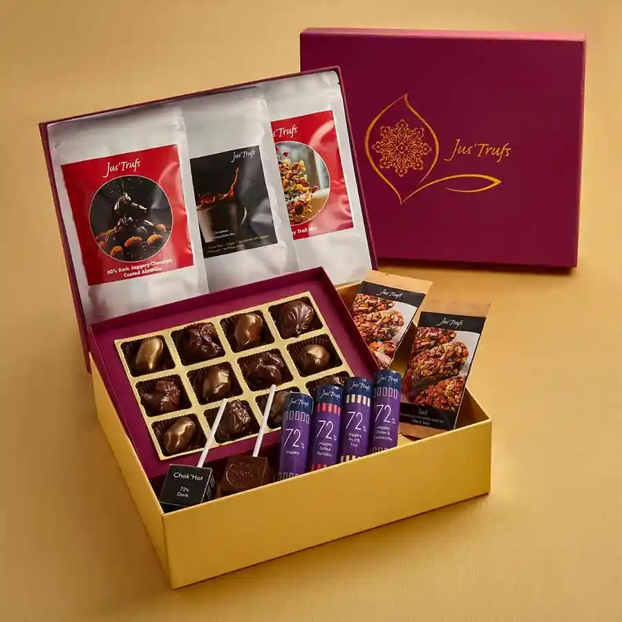 Indulgent Vegan Chocolate Hamper featuring dark chocolate sticks, almond-covered treats, trail mix, and Zeal bars, with a Diwali card
