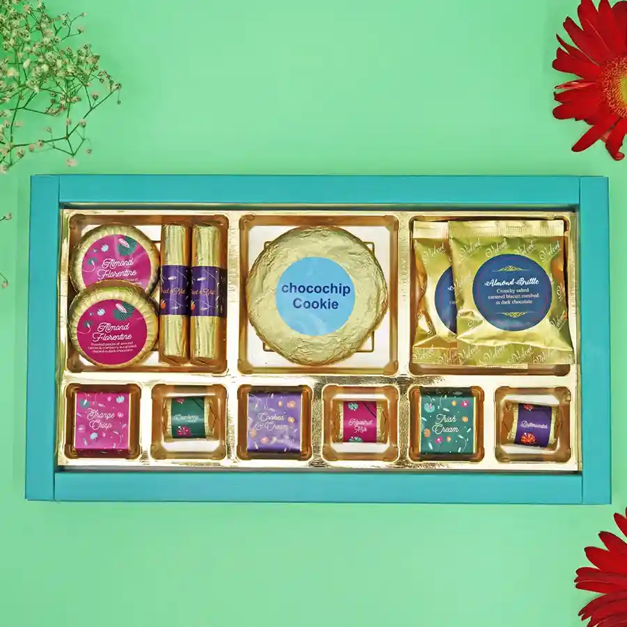 Decadent Choco Delight Gift Set featuring assorted chocolates, Almond Florentines, Chocochips Cookies, and Almond Brittles in a beautifully wrapped box.