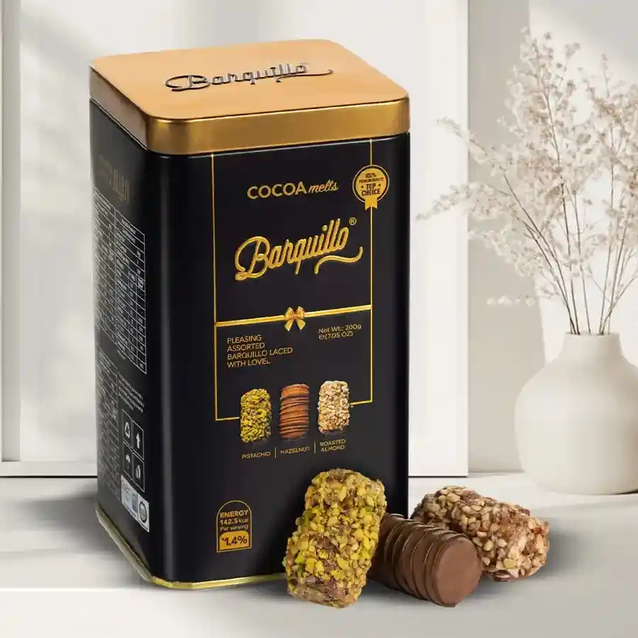 Assorted Barquillo chocolate treats in a decorative tin with various flavors and crispy wafer rolls.