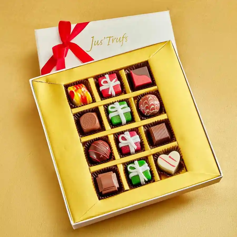 Assorted gourmet truffles and marzipan treats in a decorative Mandala box