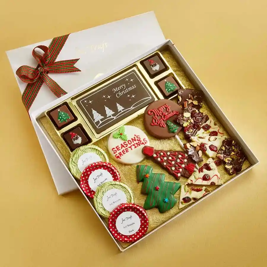 Joyful Christmas Choco Delights Treat gift box featuring chocolate bars, truffles, biscuits, lollipops, holiday-shaped cookies, and chocolate barks in a decorative Mandala container.