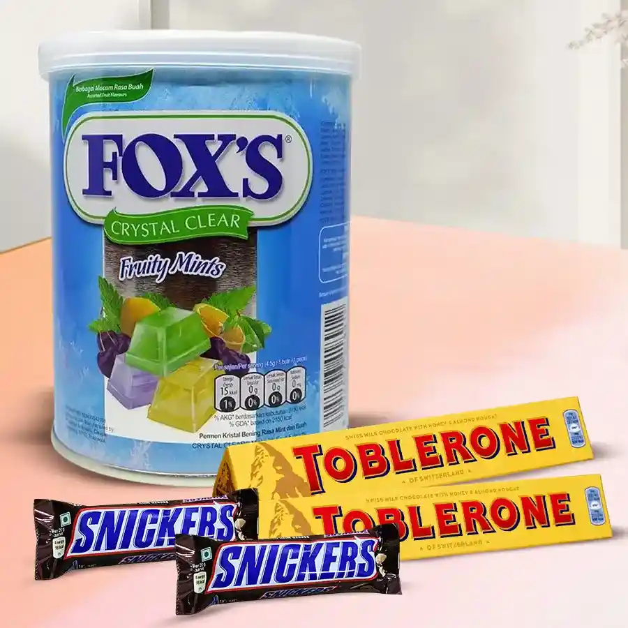 Sublime Gift Hamper of Imported Chocolates featuring Fox’s Mint Candies, Snickers bars, and Toblerone bars