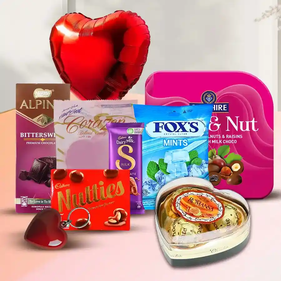 Amazing Choco Love Hamper filled with heart-shaped candies, mints, chocolates, a balloon, and a key ring arranged in a festive display.
