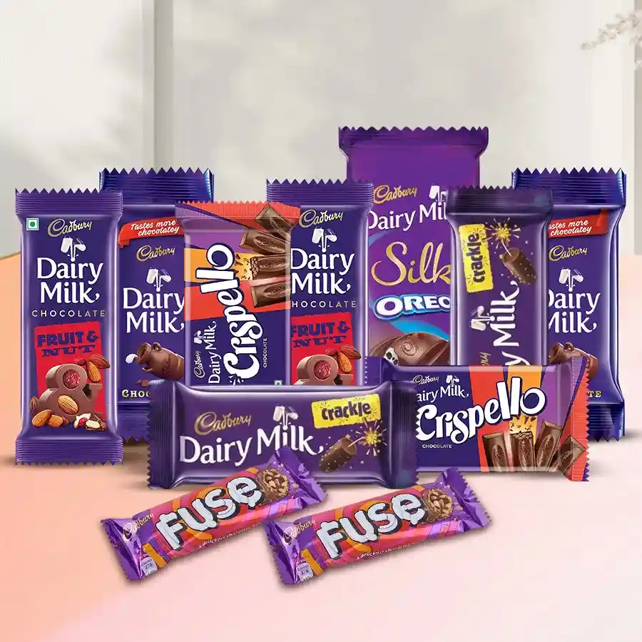 Assorted Cadbury chocolate bars including Fuse Milk, Dairy Milk, Crispello, Crackle, Fruit & Nut, and Dairy Milk Oreo in a gift box.