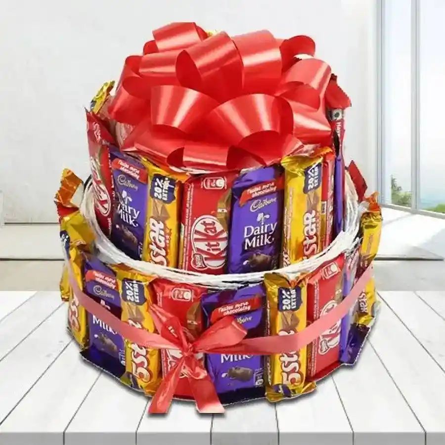 Double deck arrangement of assorted chocolates including Cadbury Dairy Milk bars, Nestle KitKats, and Cadbury Five Stars in an elegant presentation.