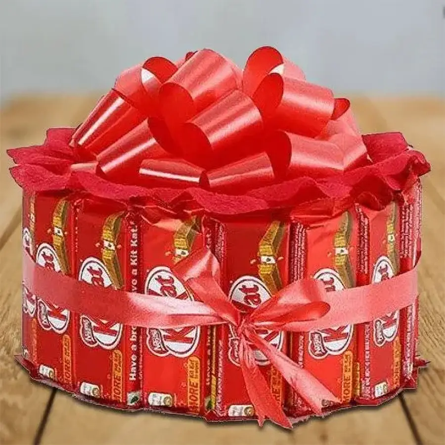 Special Round Shape KitKat Arrangement with 15 KitKats tied with a vibrant red ribbon